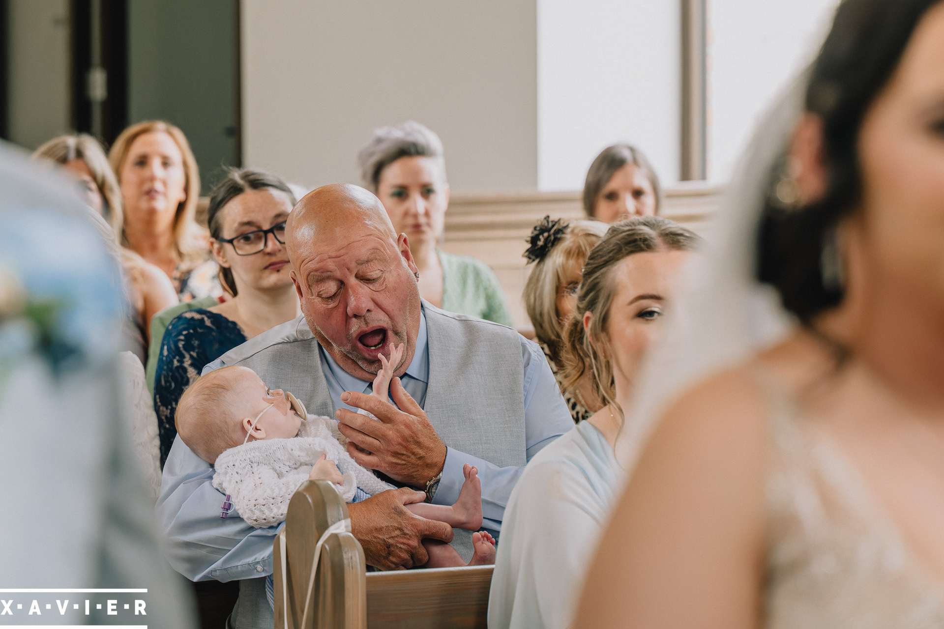 baby plays with grandad