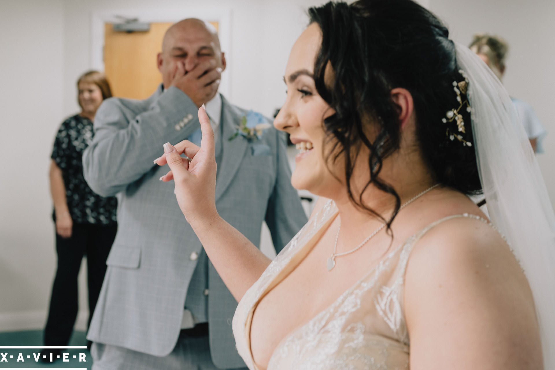 bride and father are emotional as they see each other for the first time