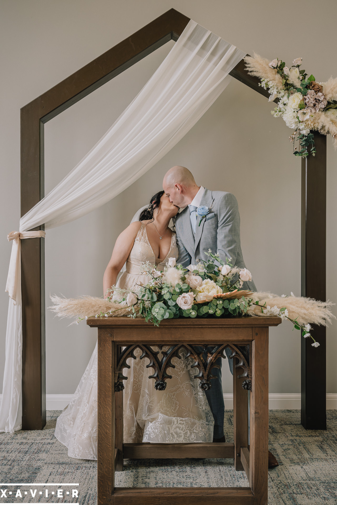 bride and groom at altar