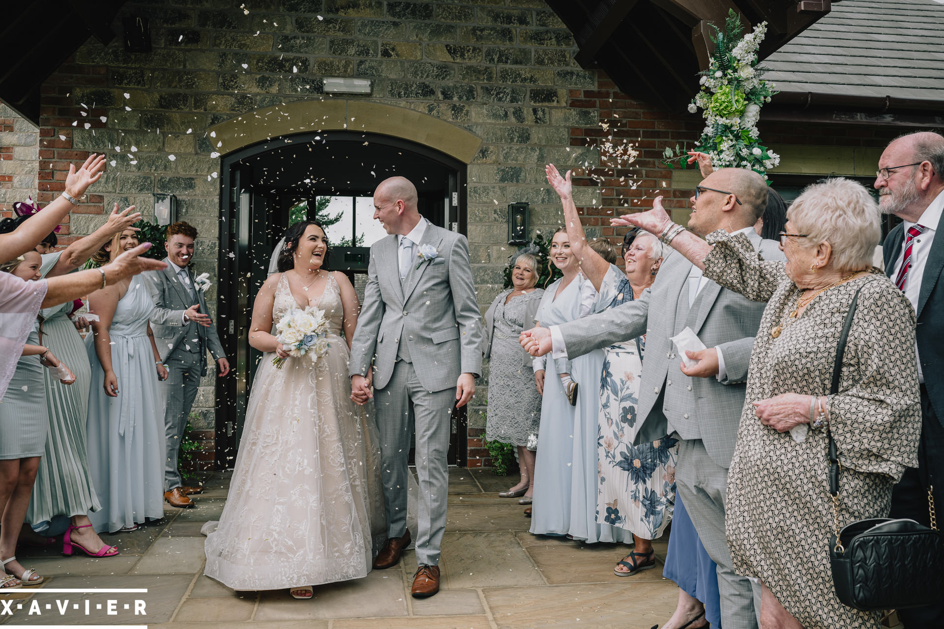 confetti thrown over bride and groom