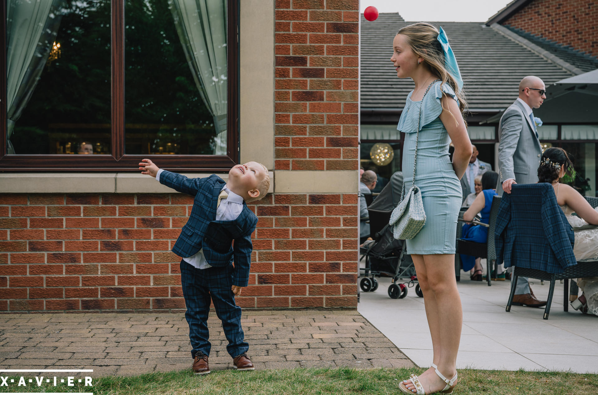 child throwing ball during reception