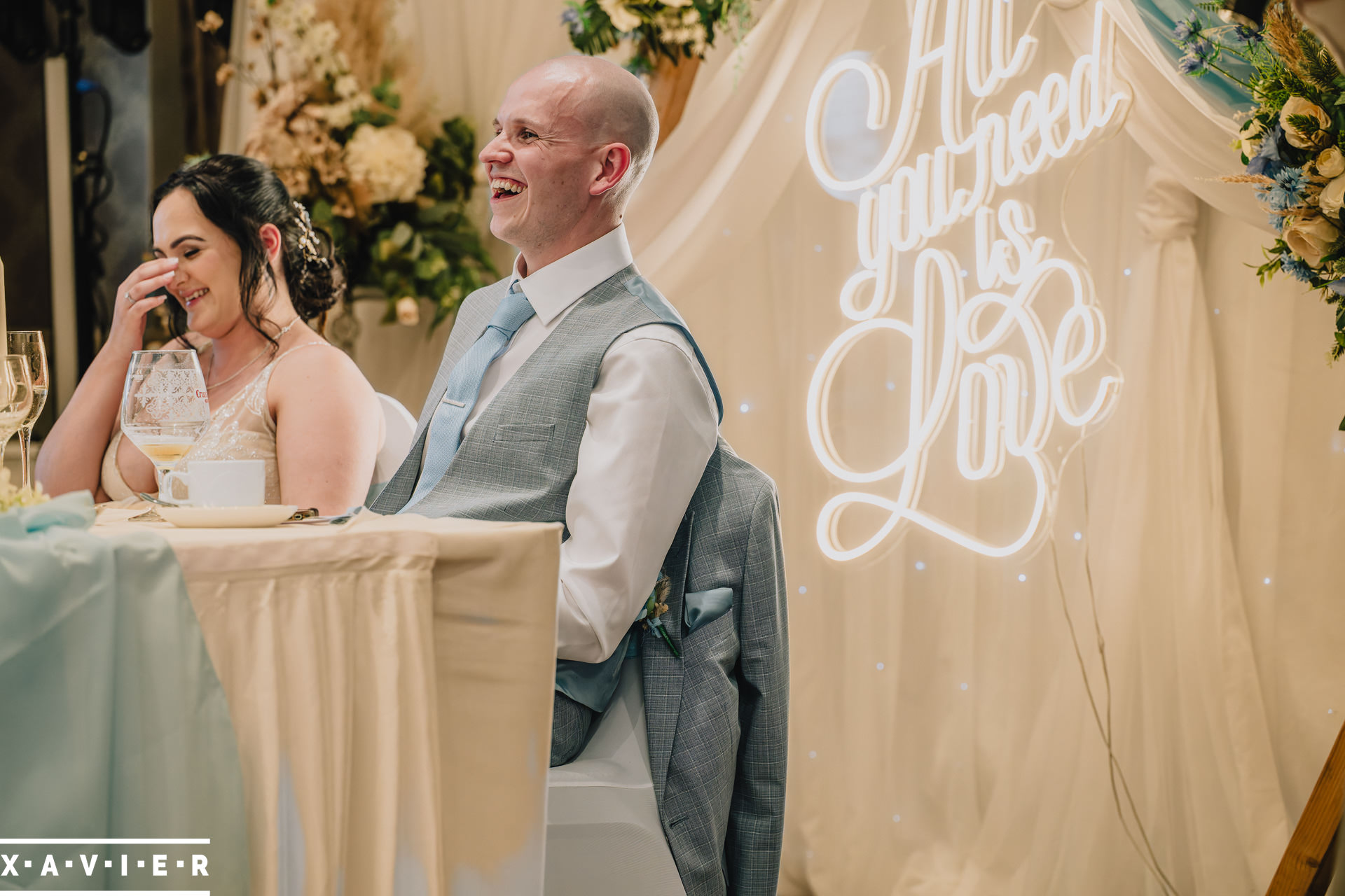 bride and groom laughing