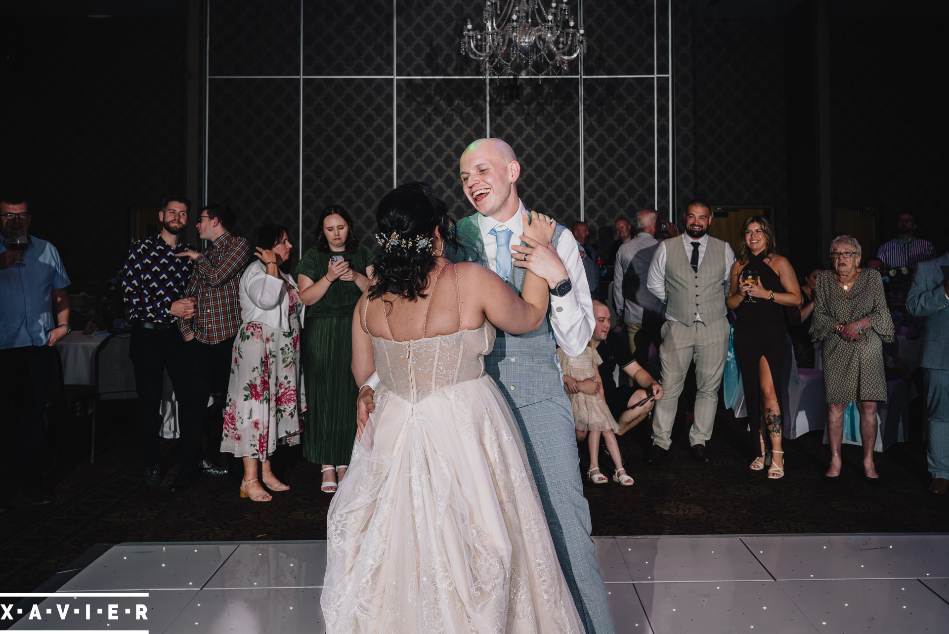 bride and groom react as the cake is cut