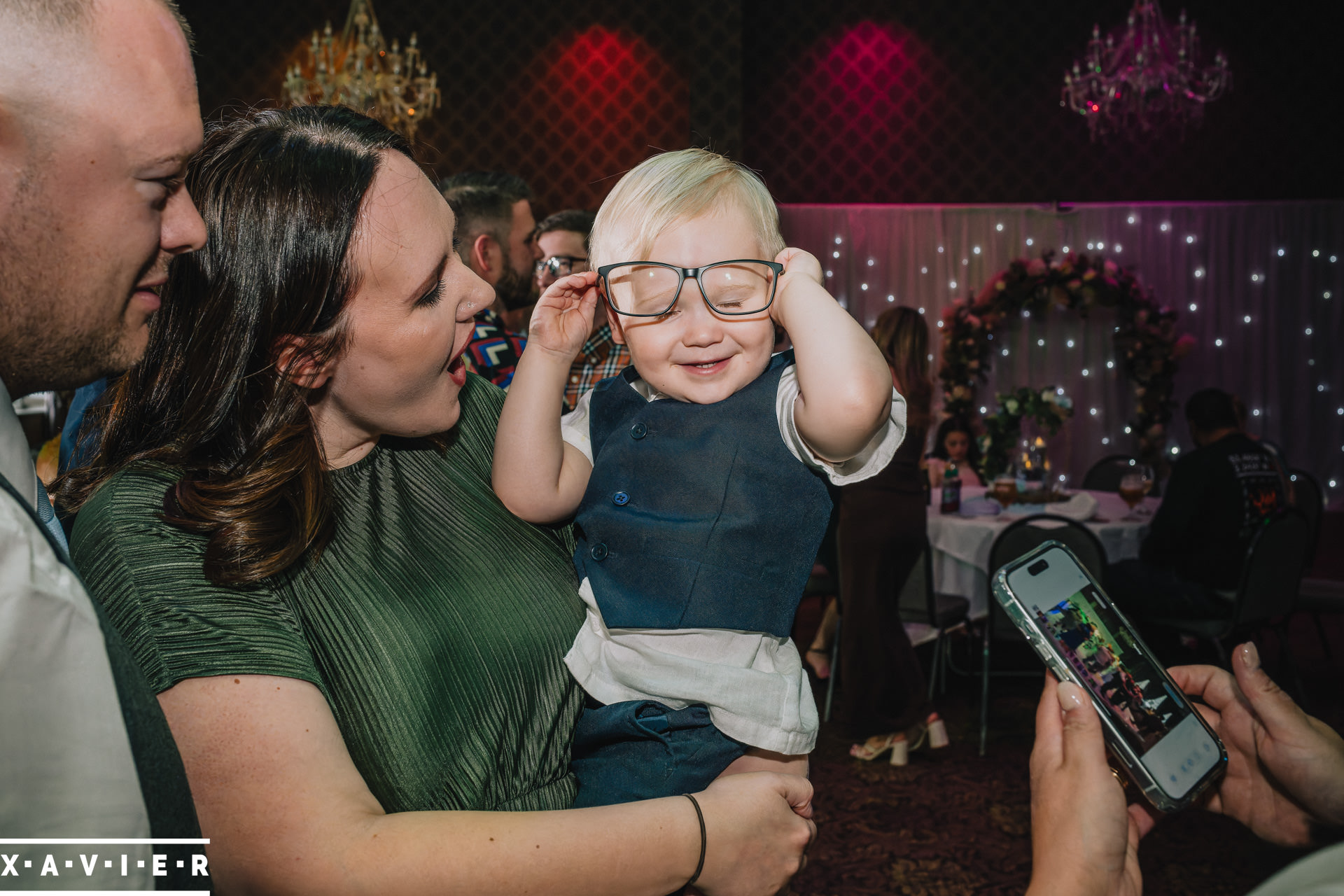 child tries on glasses