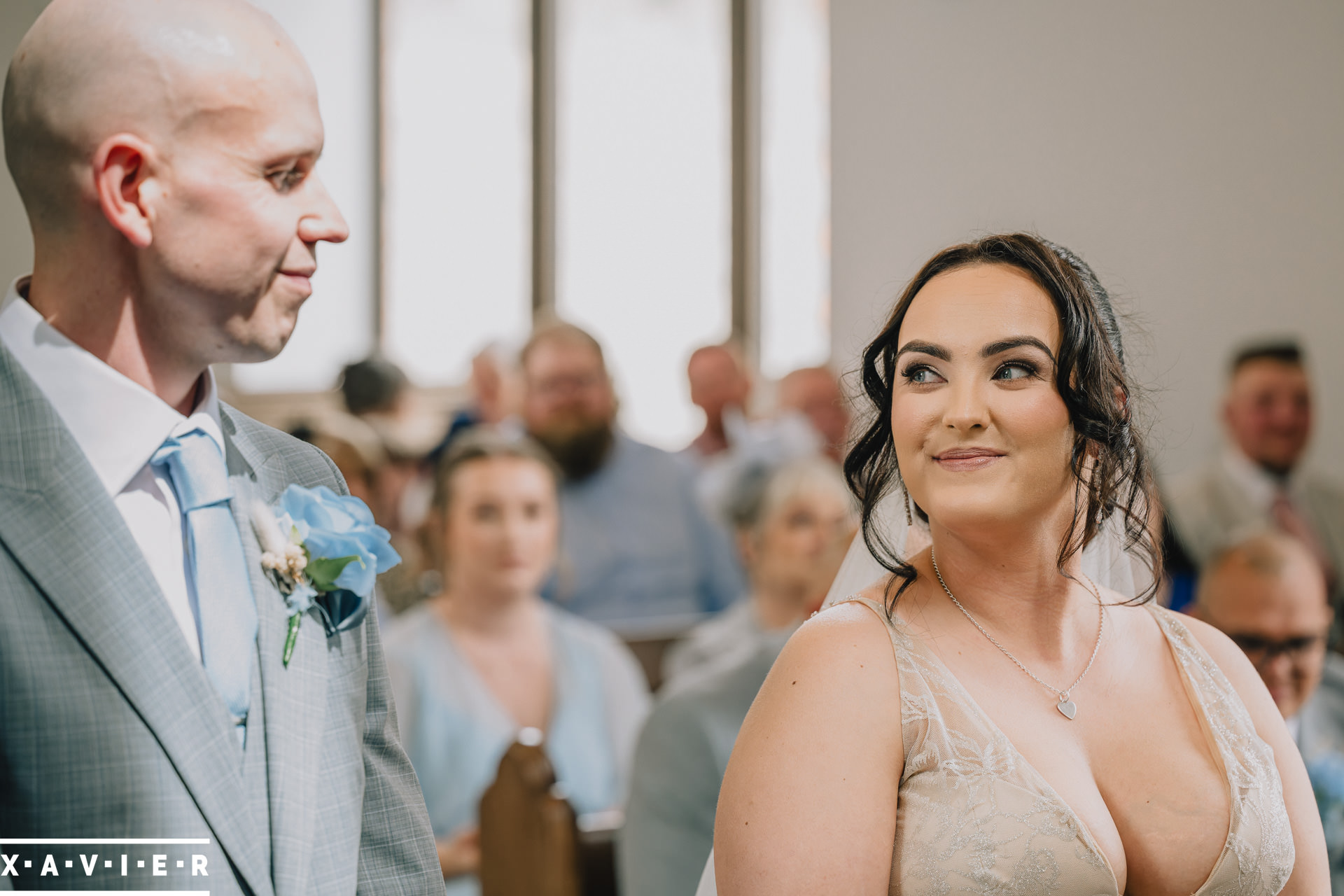 bride looks at groom