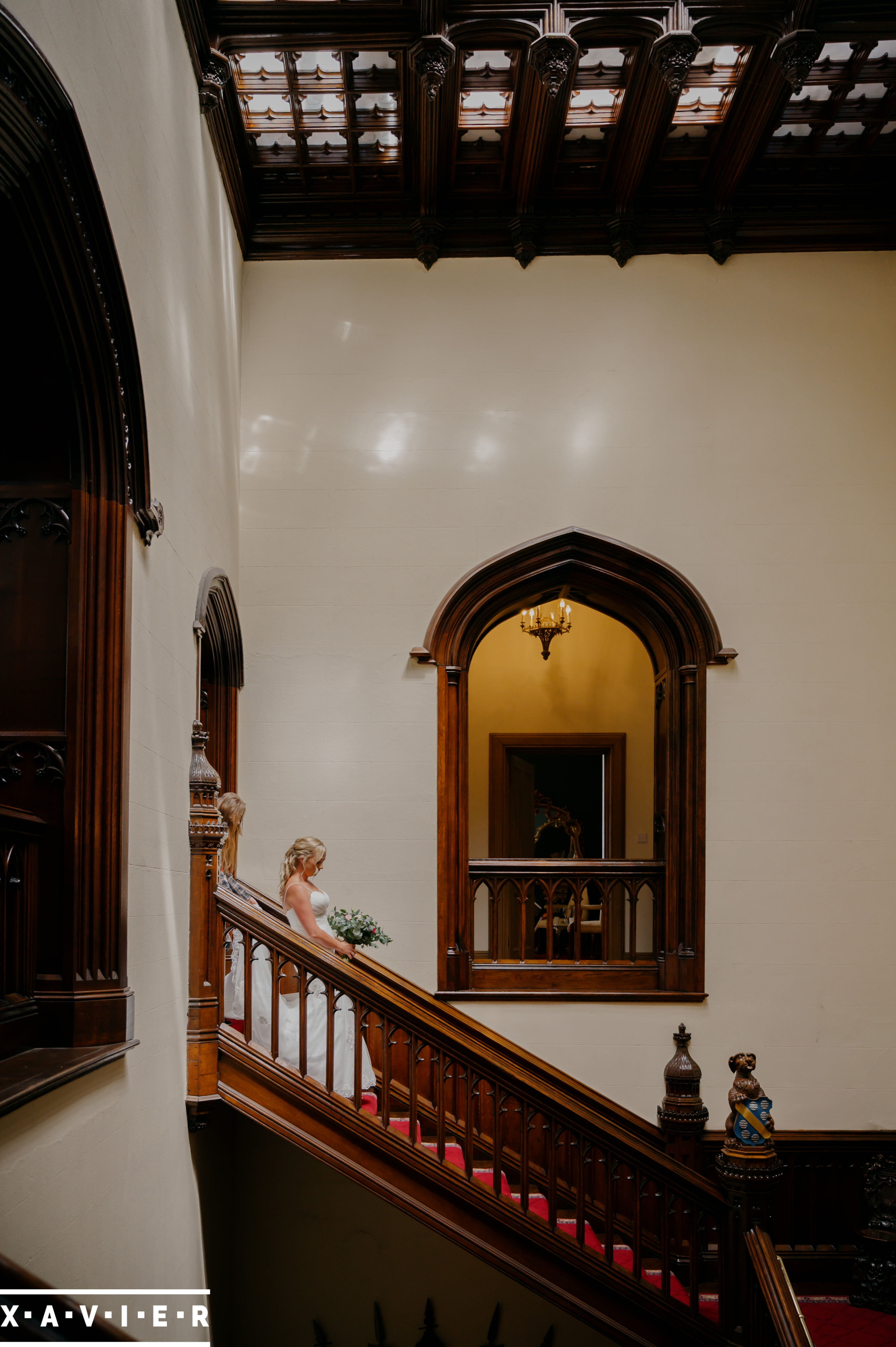 bride walking down the stairs at allerton castle