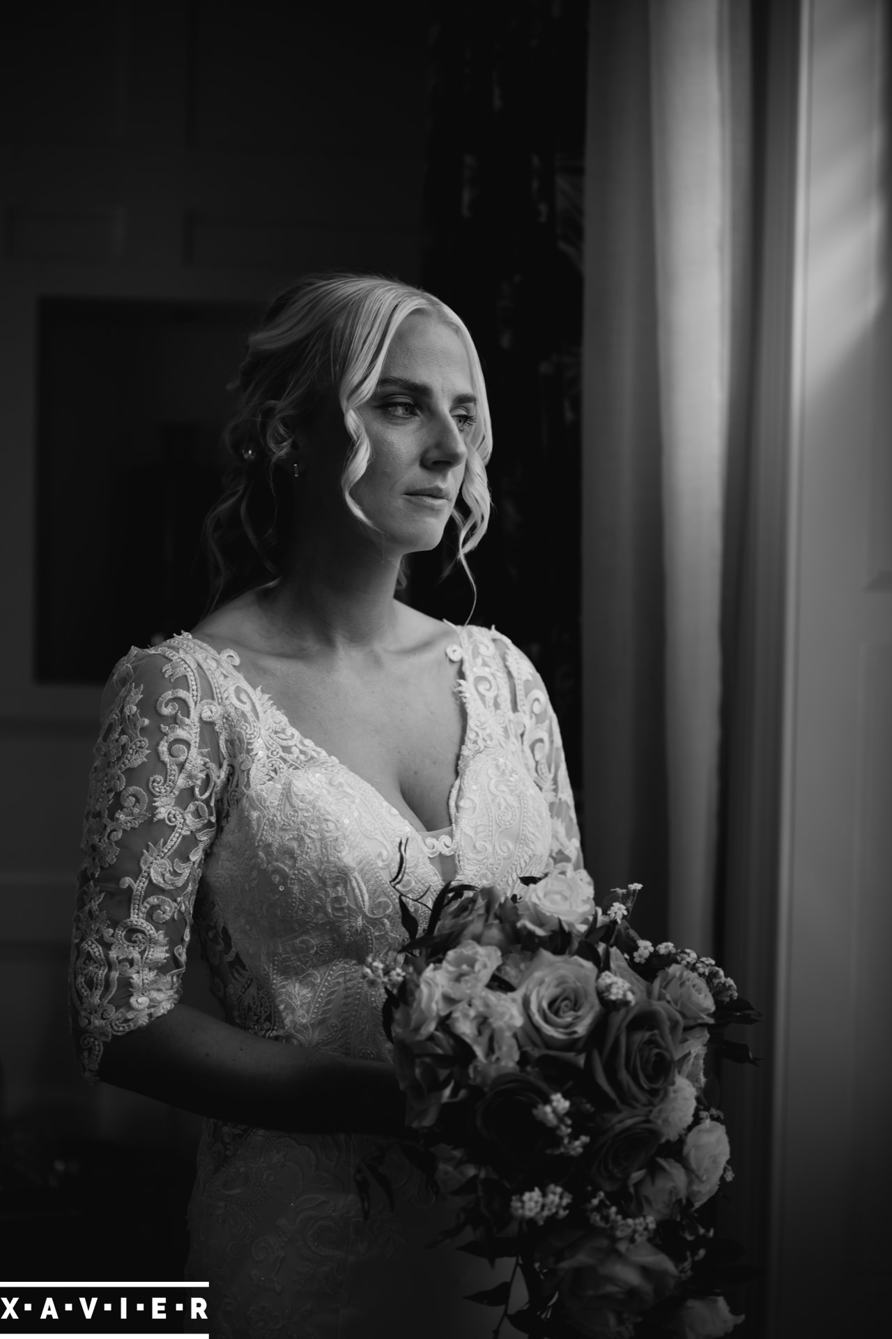 bride and groom twirl on the lane