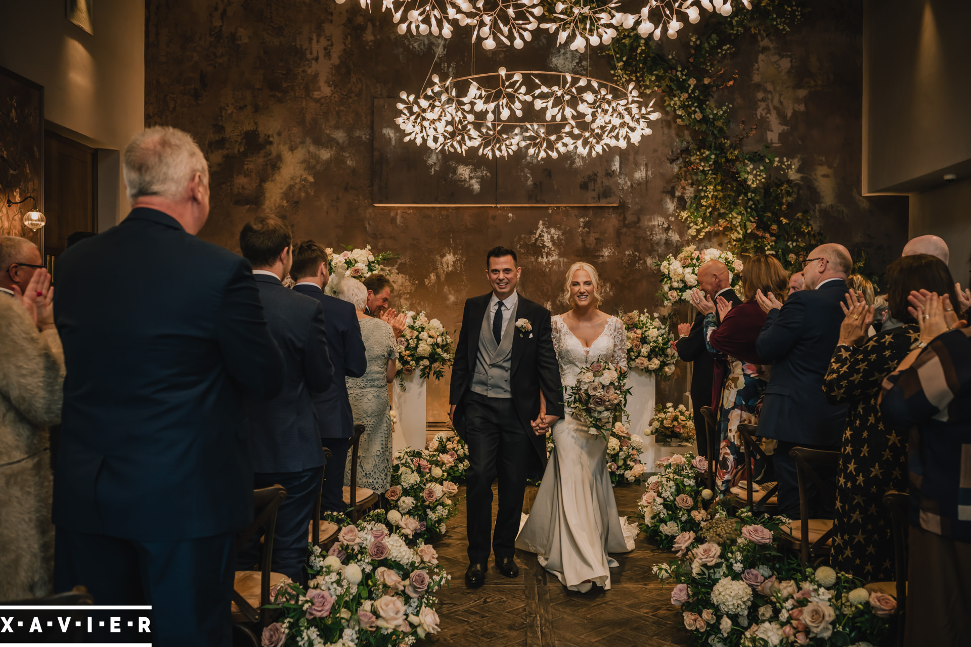 bride and groom walk the aisle