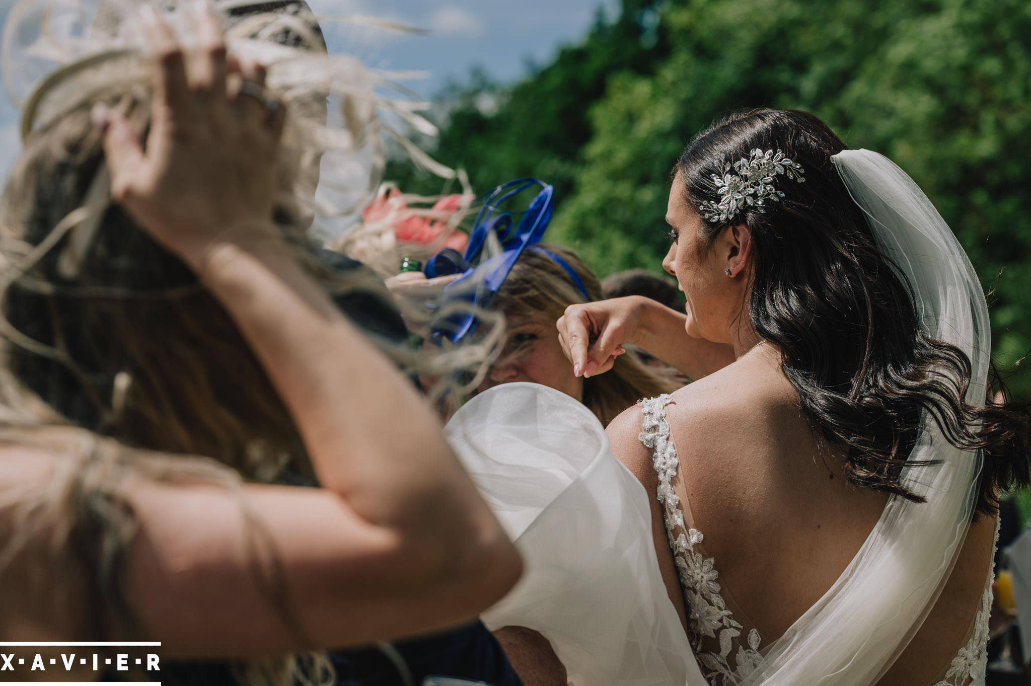 bride points to her dress