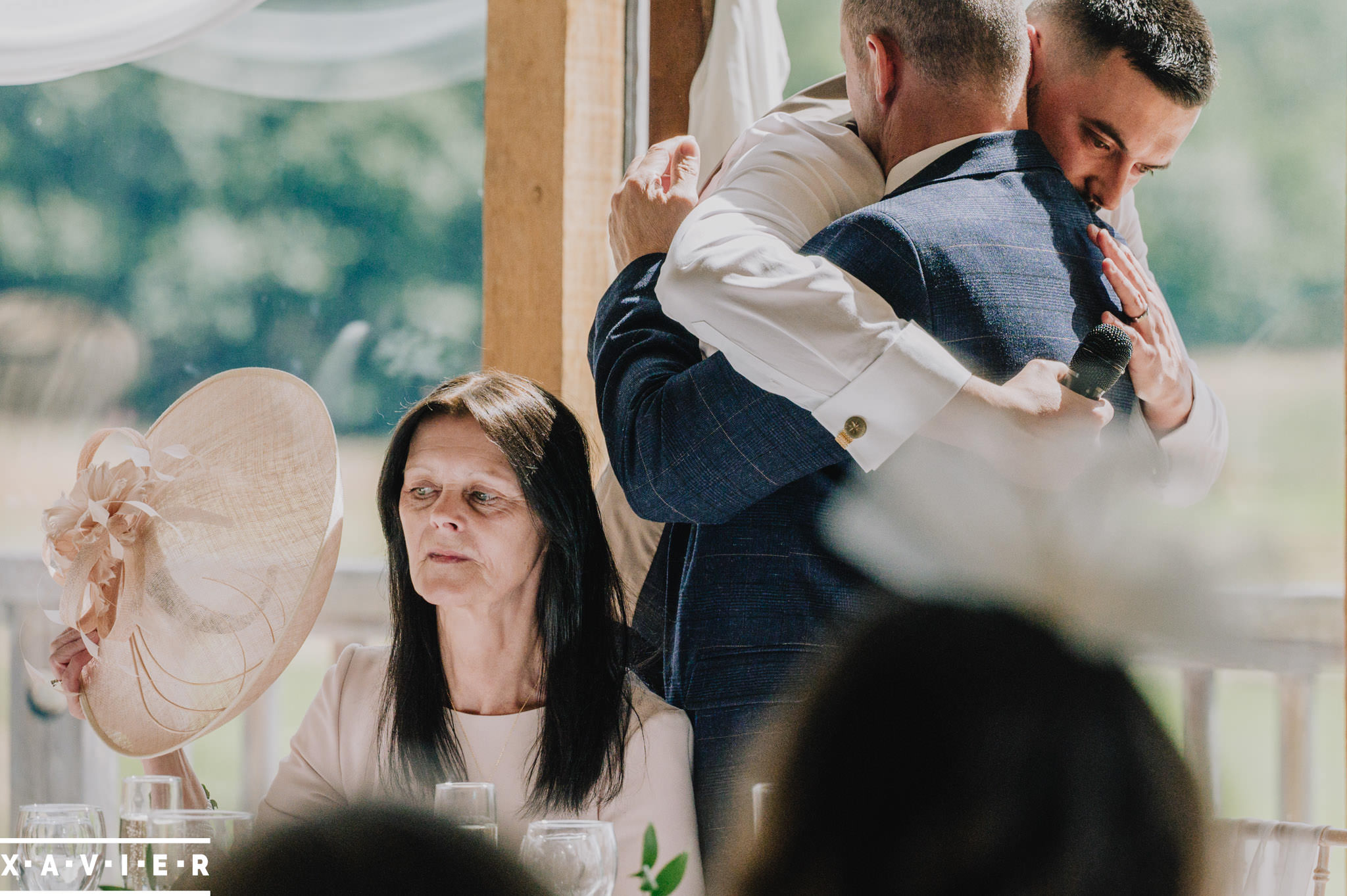 groom hugs the best man after his speech
