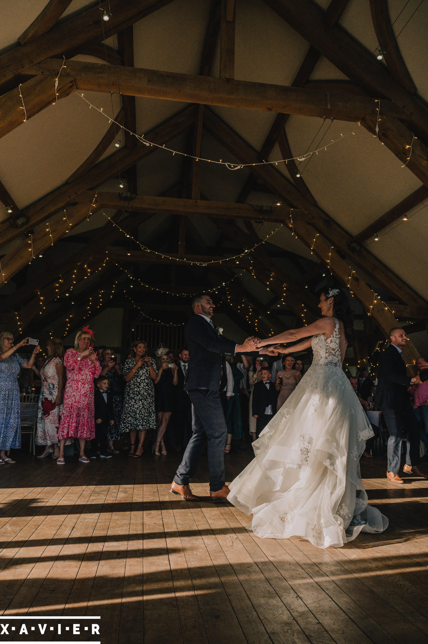 bride and groom first dance in the grand hall