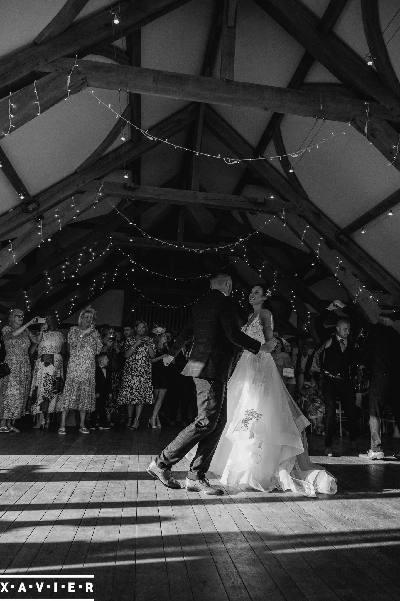 bride and groom dancing in the garnd hall