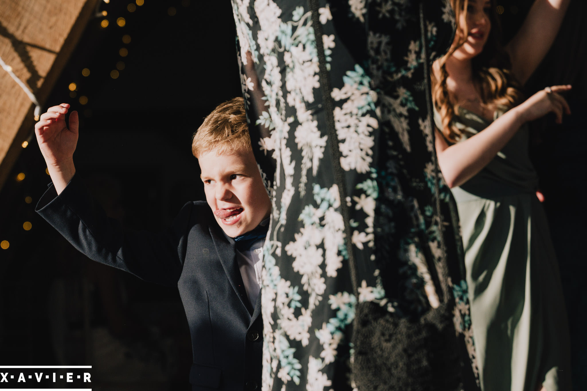 child pulling faces during the evening reception