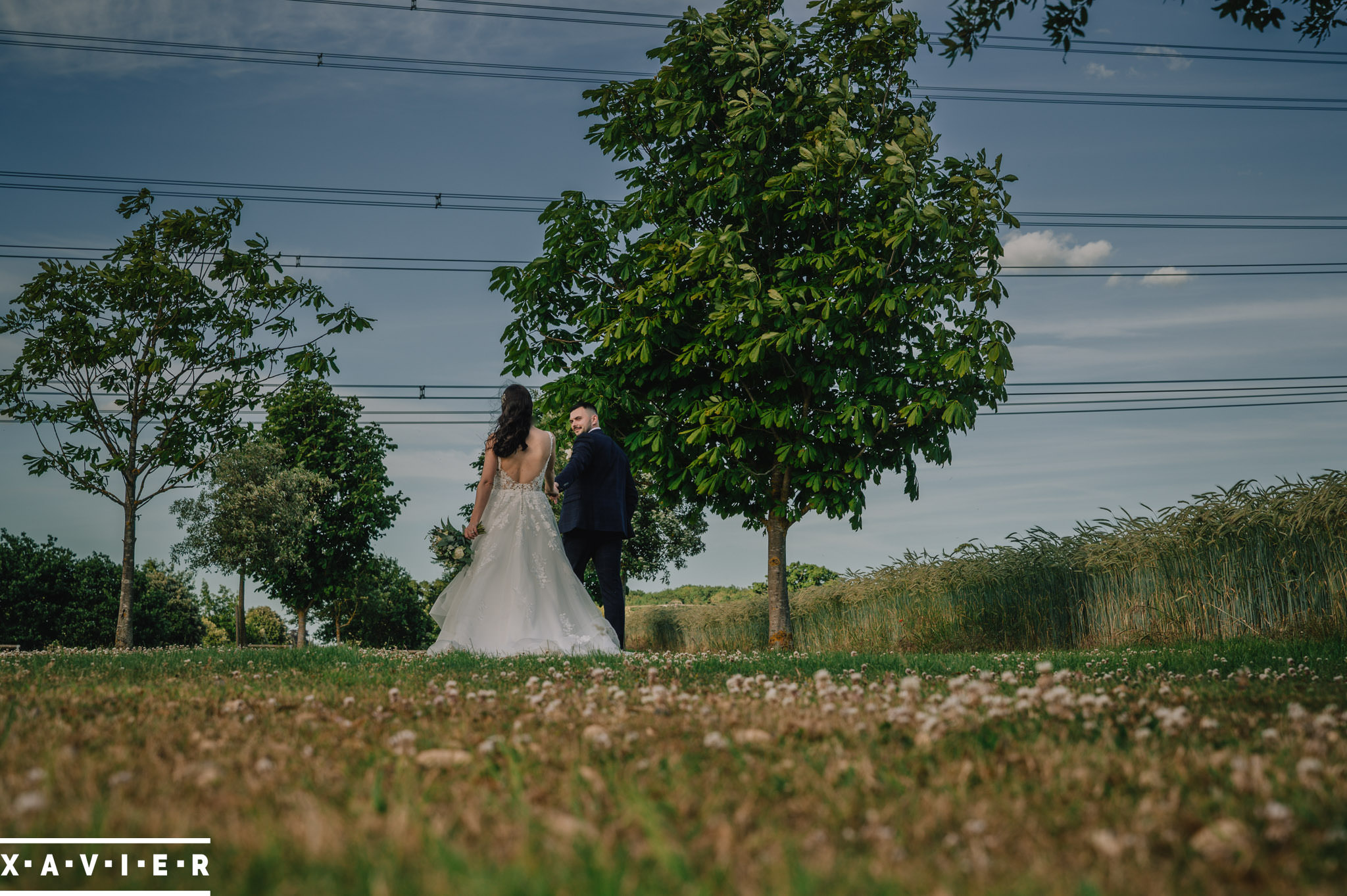 bride and groom walking in the grounds
