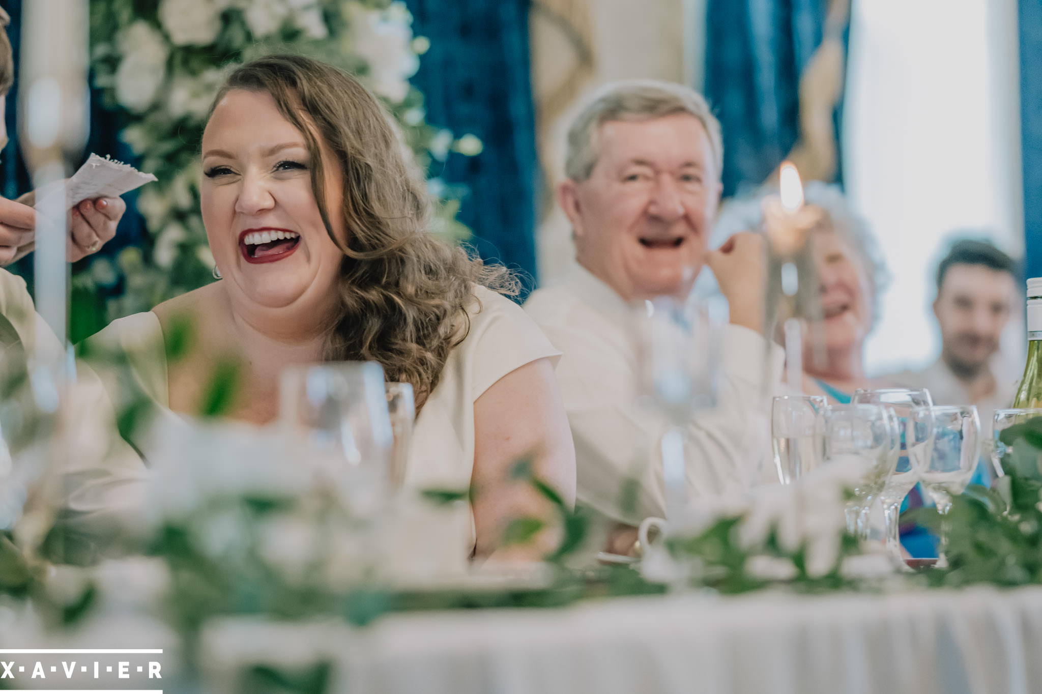 bride laughing during speeches