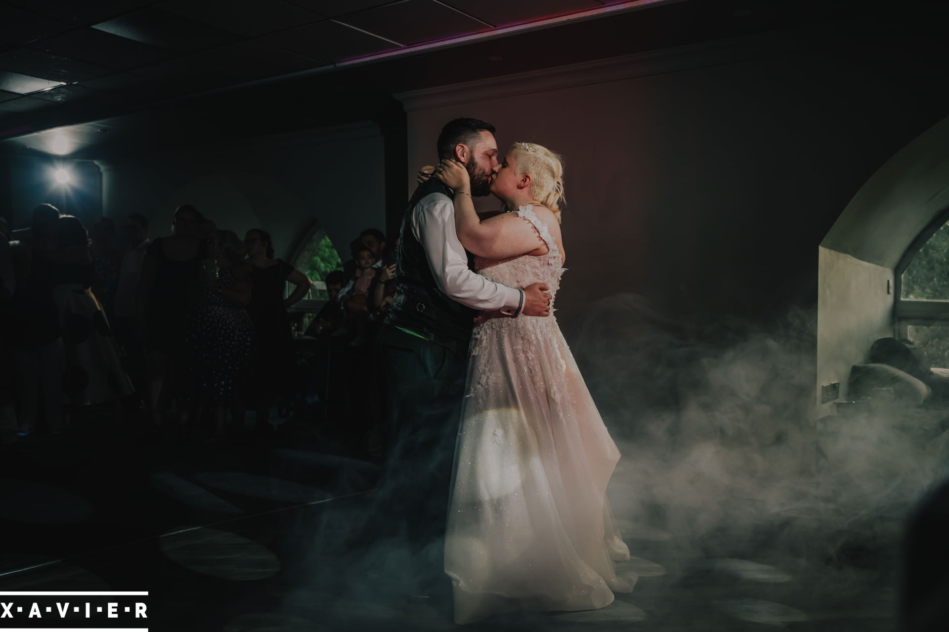 bride and groom kiss during first dance