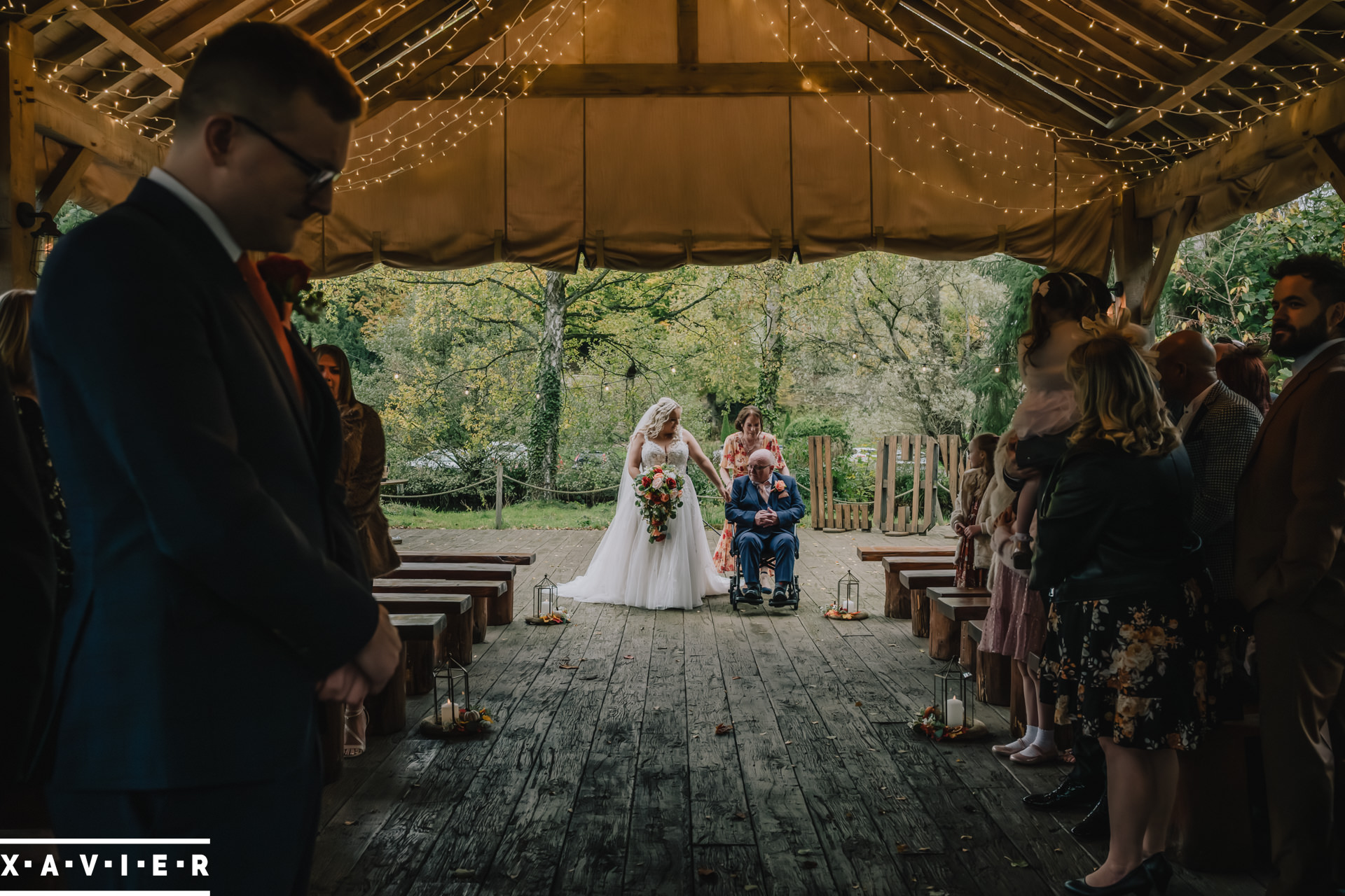 bride and father walk up the aisle