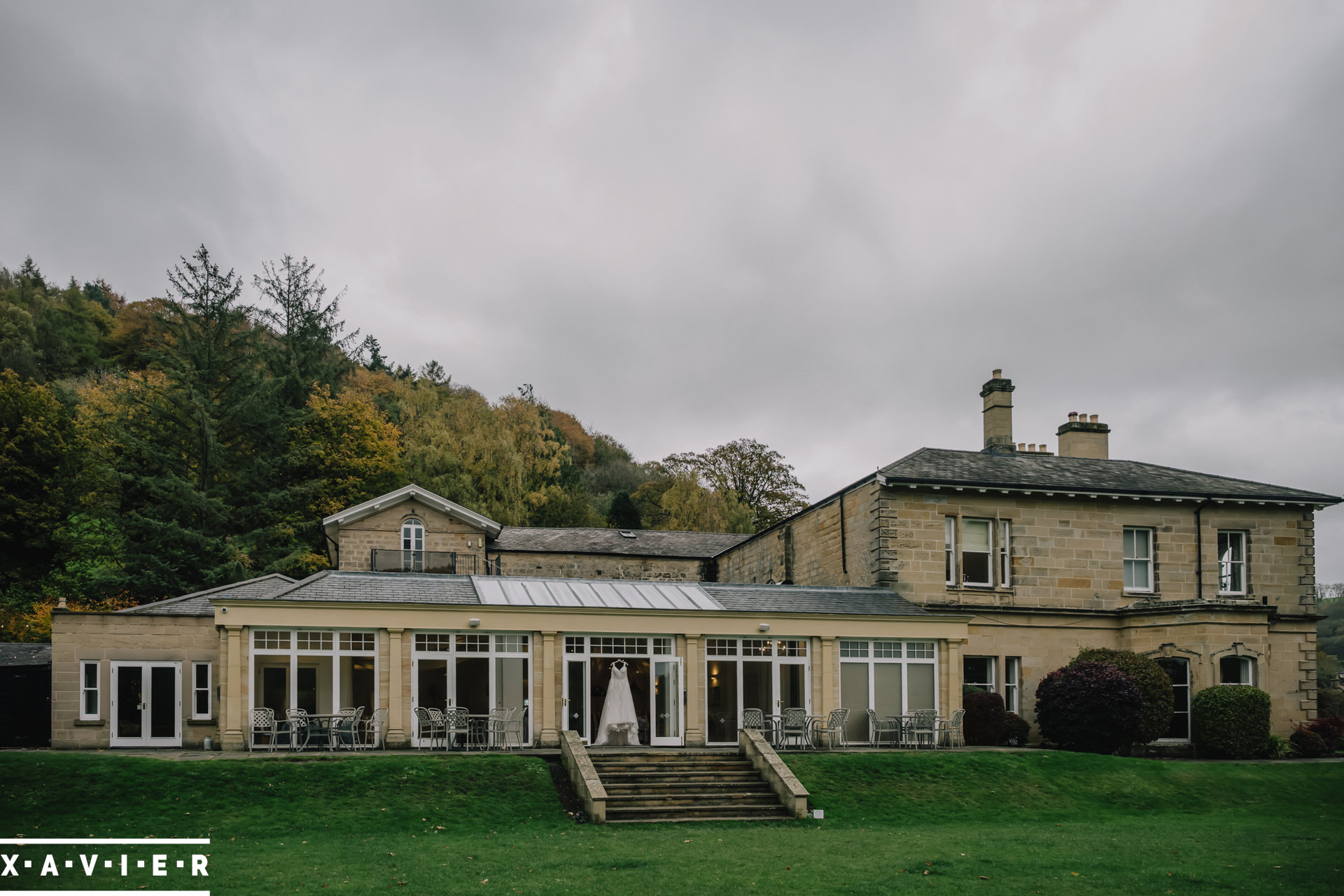 wedding dress hanging in the window
