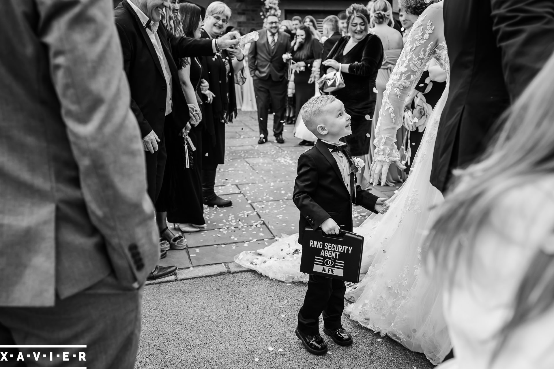 ring bearer holds his case tightly