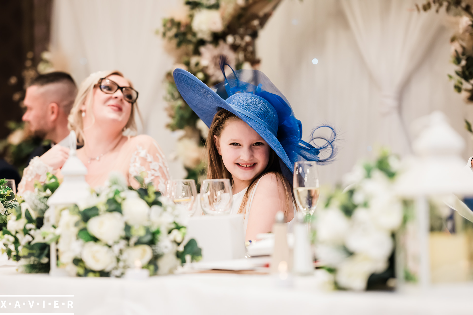 Flower girl wearing a wedding hat