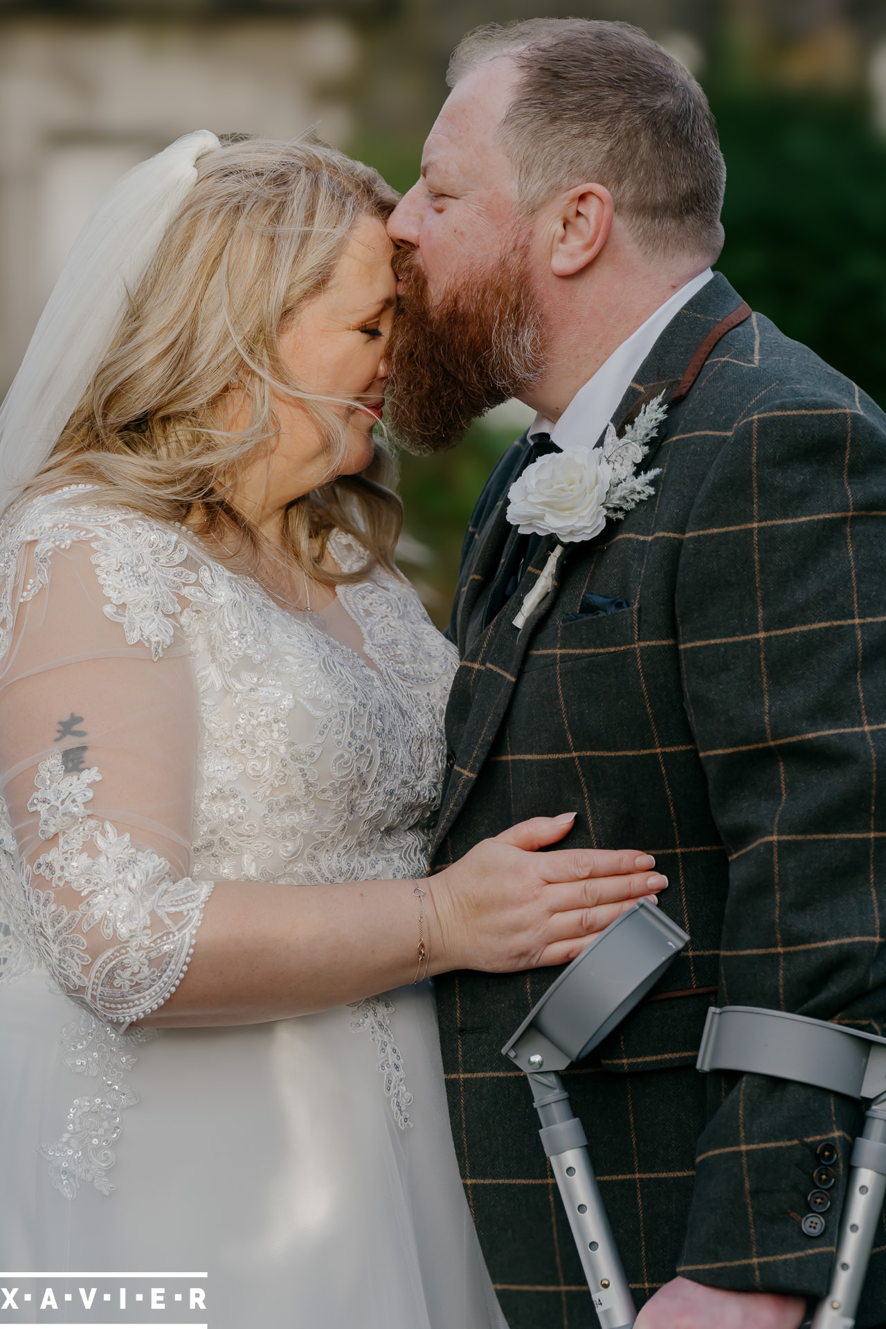 bride and groom standing on the stairs