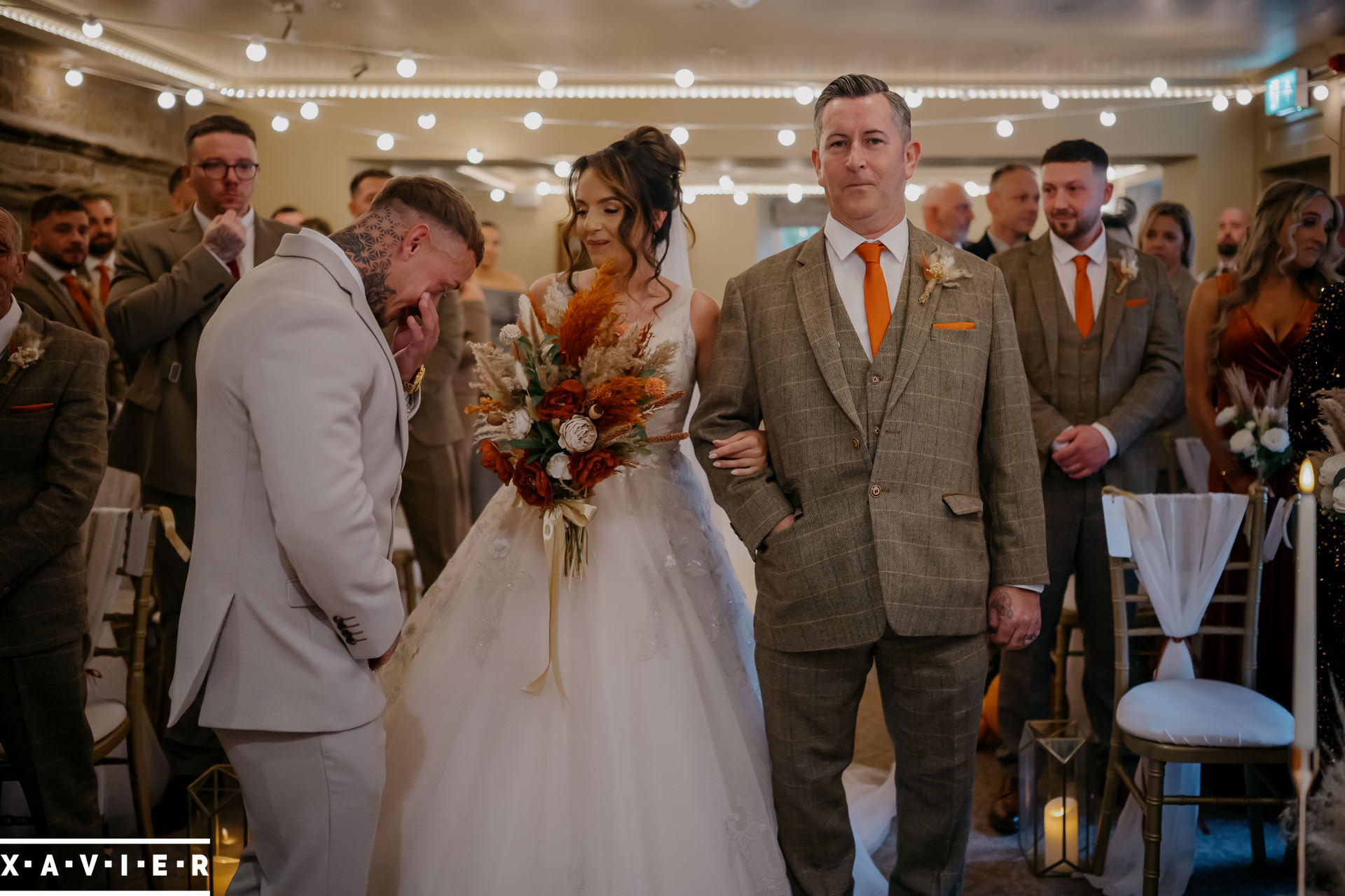 groom is emotional during the ceremony
