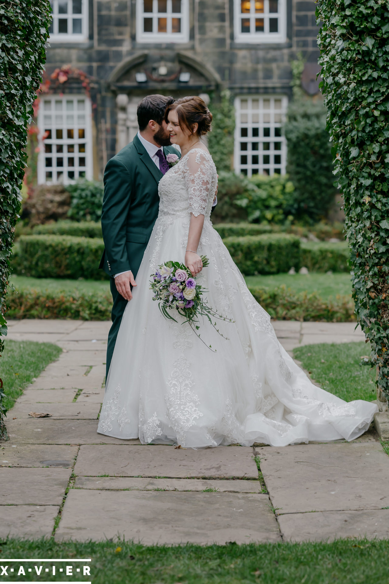bride and groom standing in the gardens