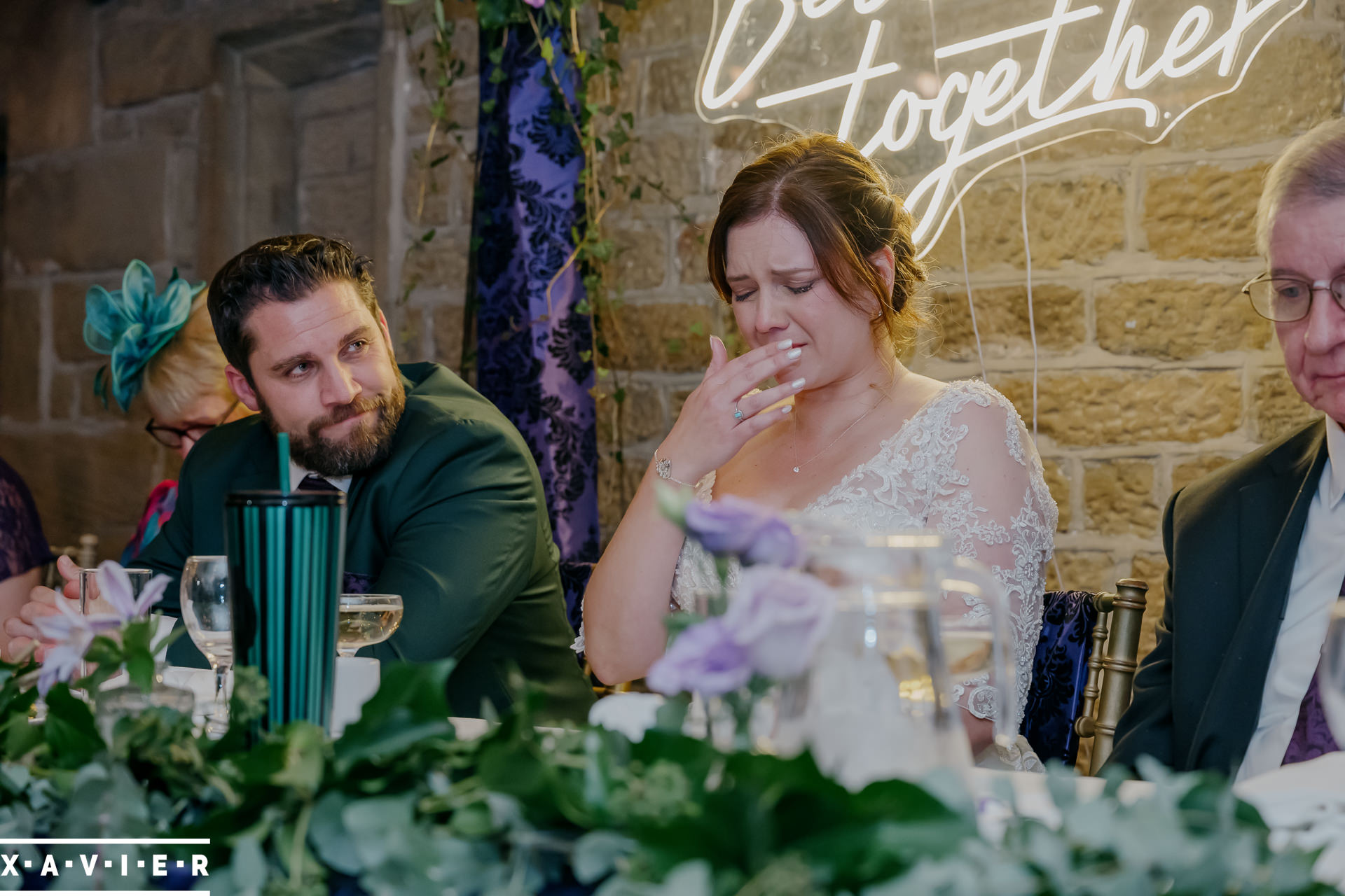 bride is emotional during the speeches