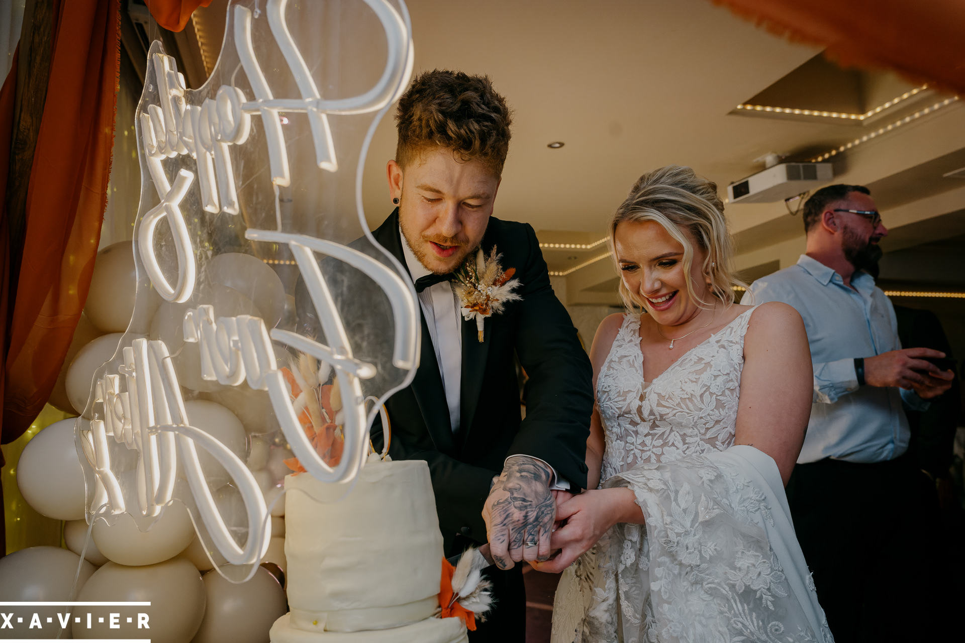 bride and groom cutting the cake