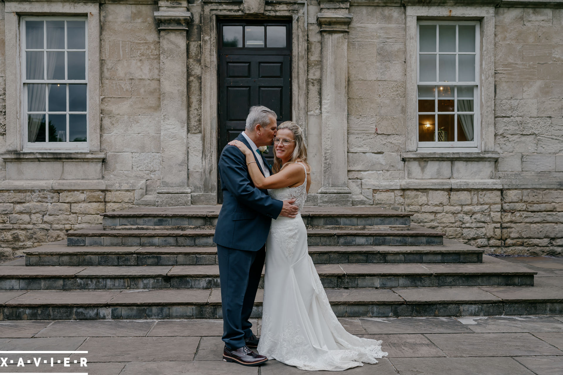 groom whispers in the brides ear