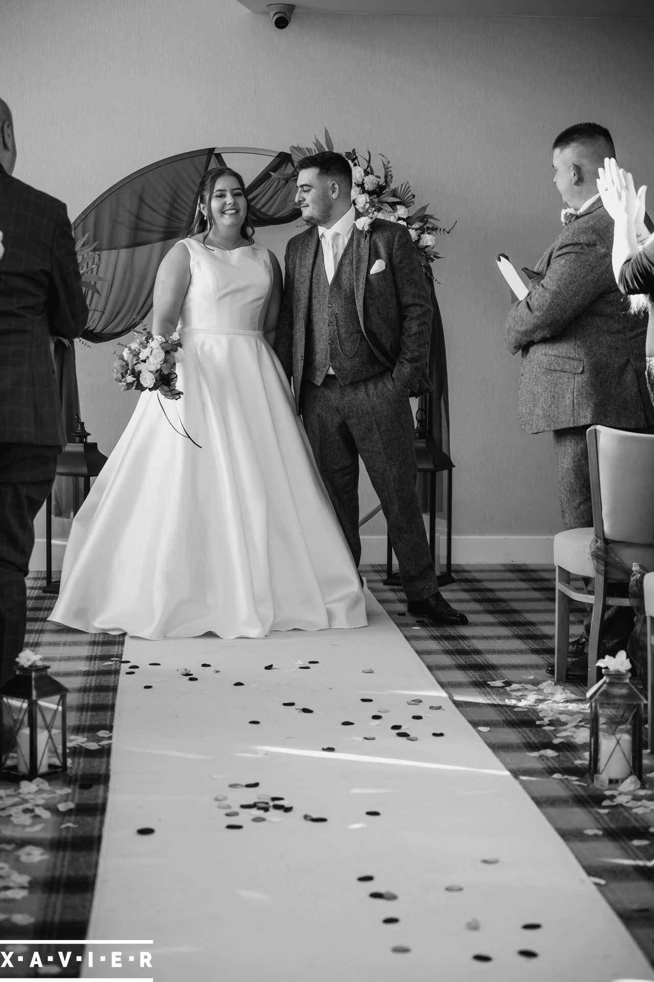 Bride and groom walk down the aisle