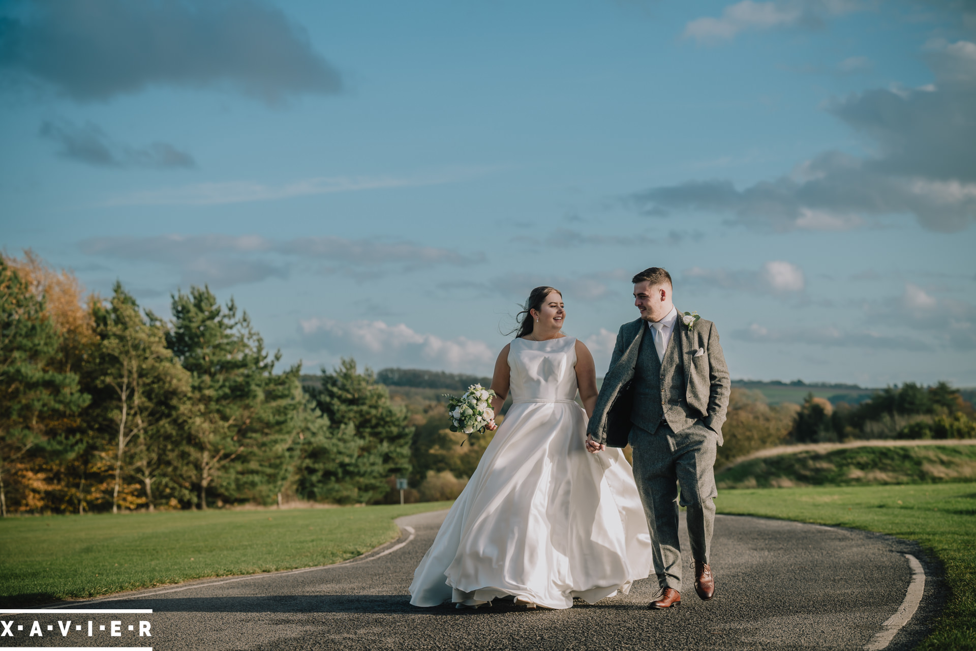 bride and groom take a walk outside
