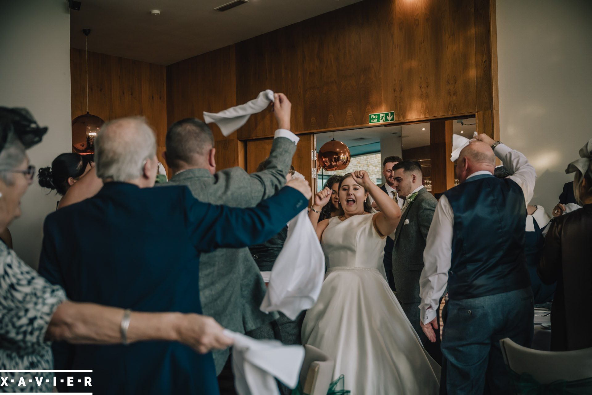 bride ansd groom enters the wedding breakfast room