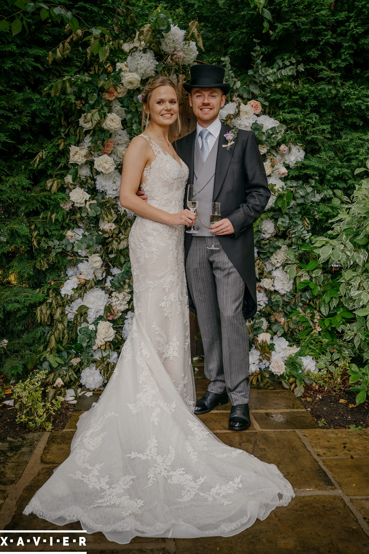 bride and groom outside the coach house