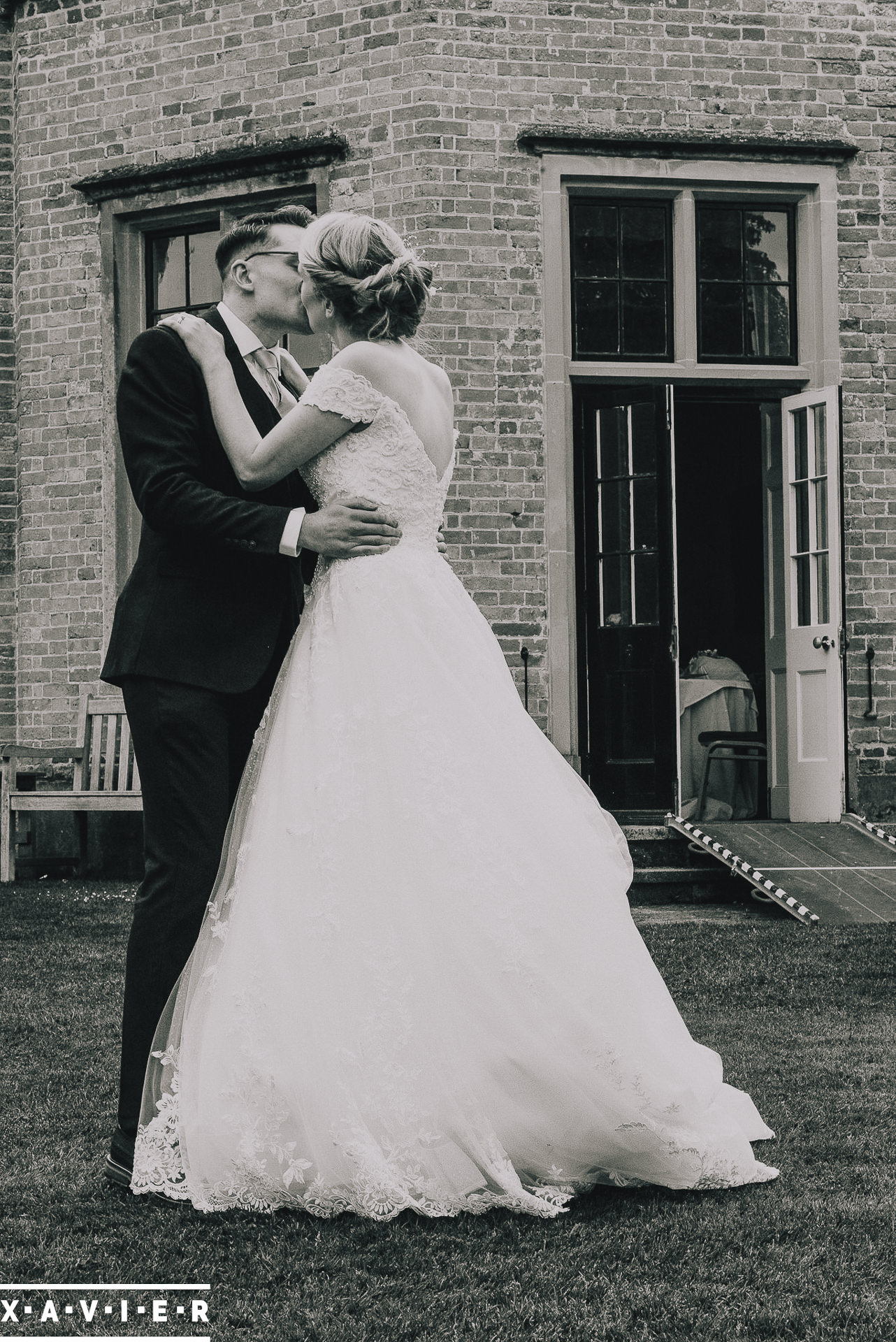 Bride and groom dancing in the gardens
