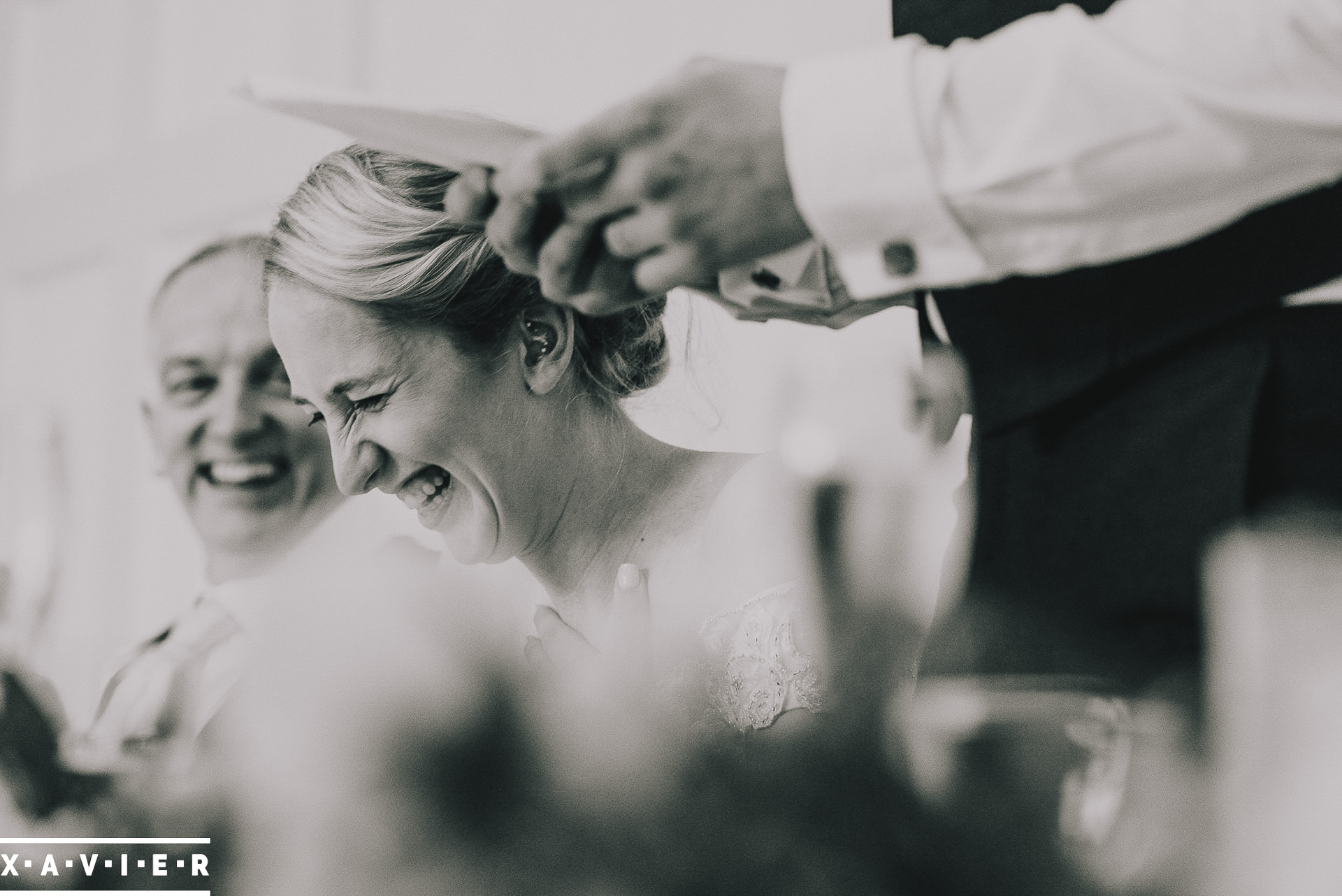 bride laughs during the speeches