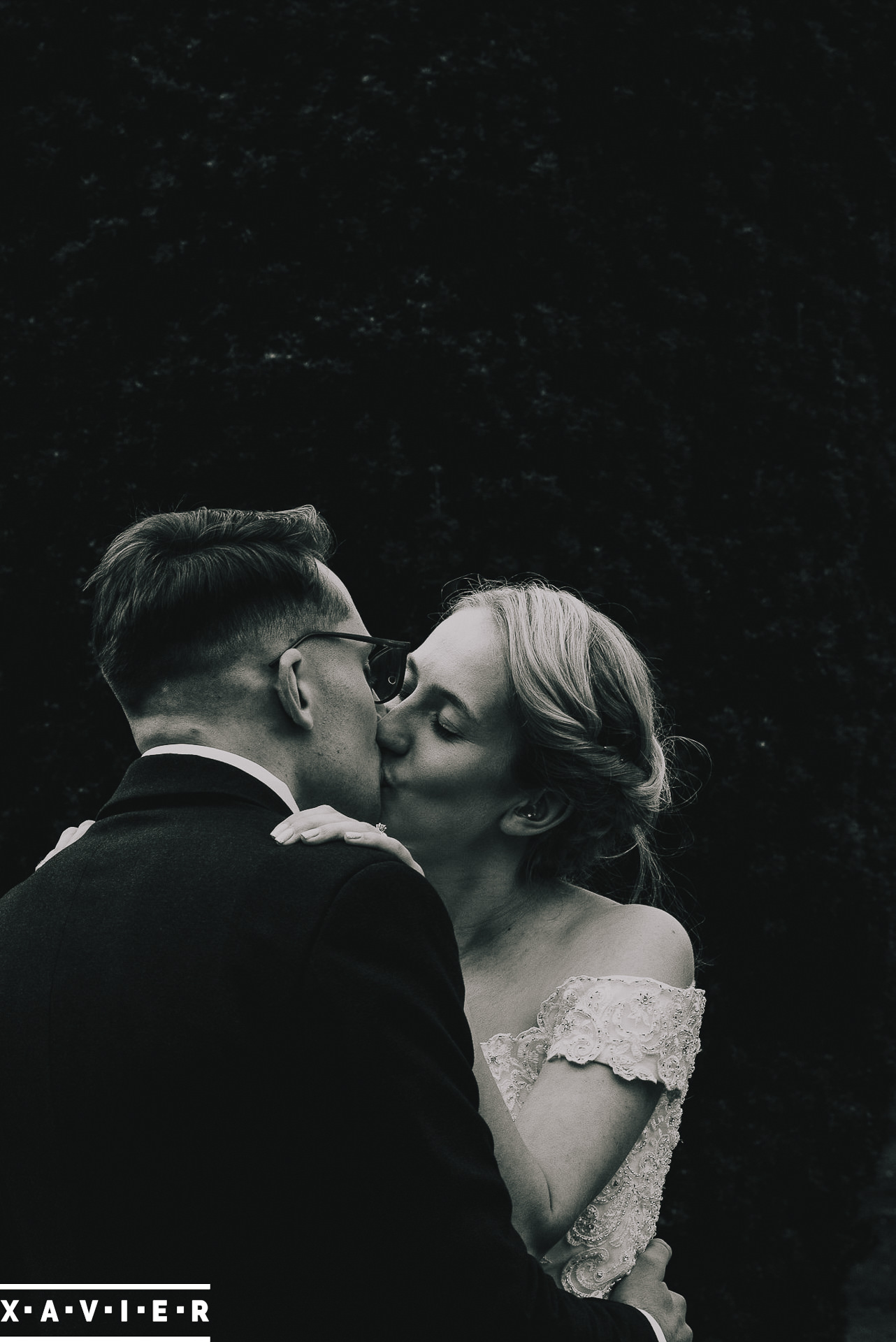 bride and groom kiss during the first dance