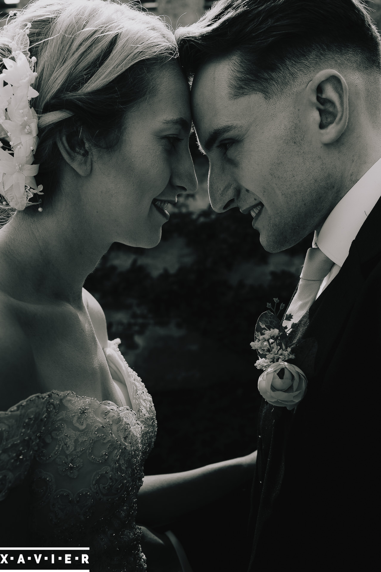 bride and groom stand close to each other