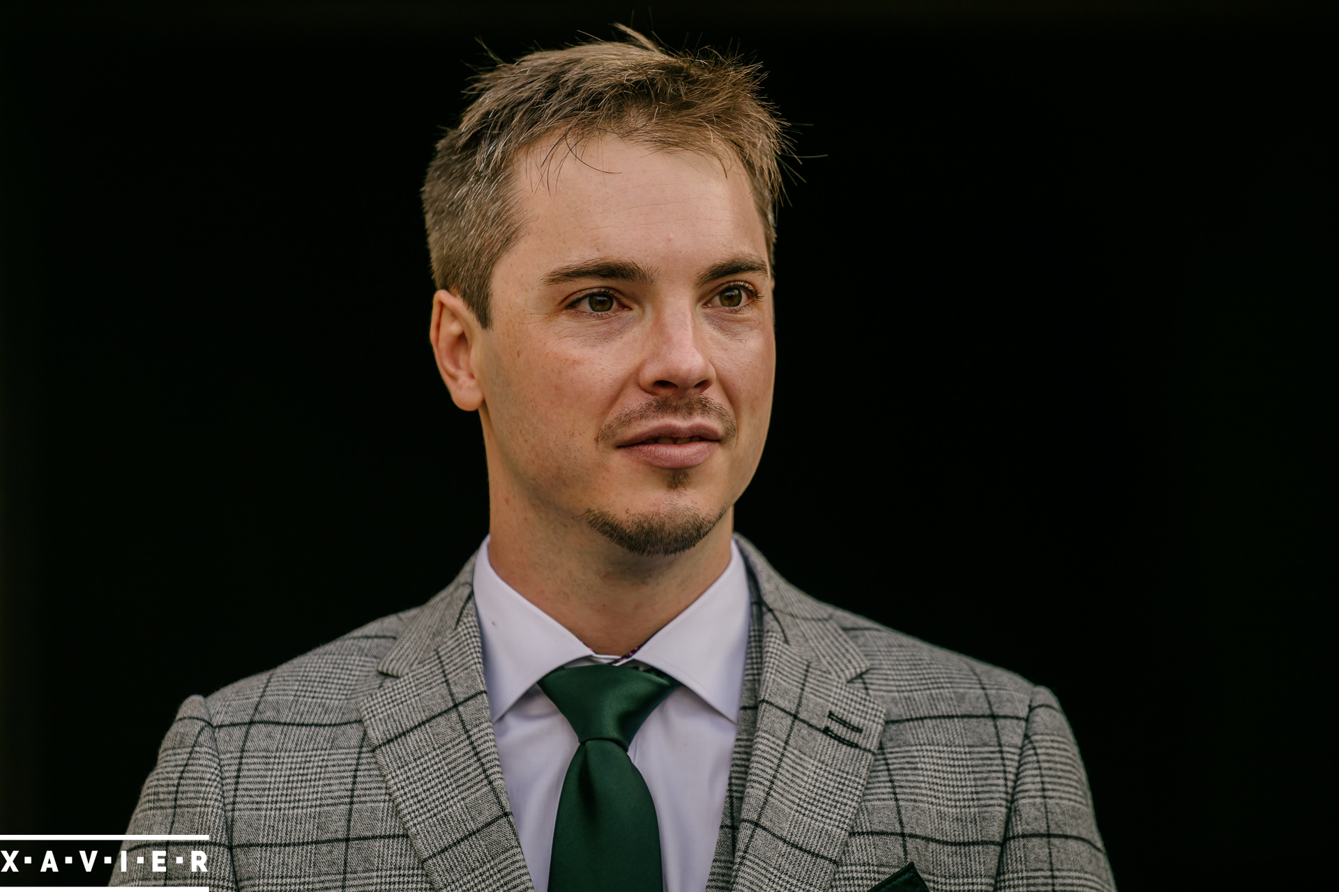 groom looks on during the ceremony