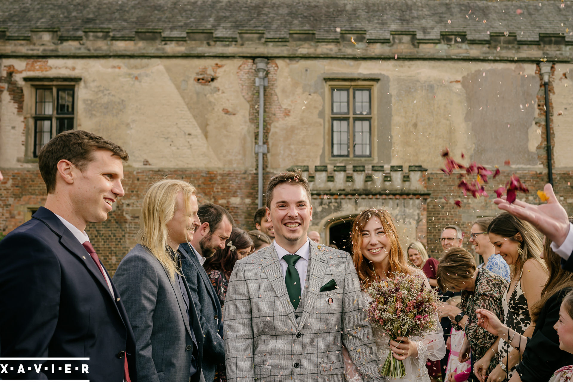 bride and groom walk the confetti line