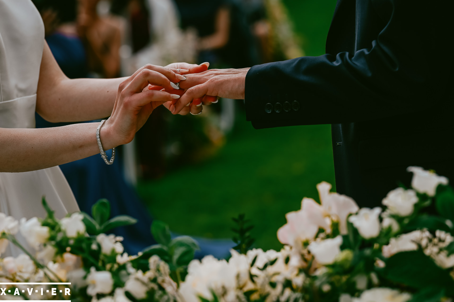 bride puts the grooms ring on his finger
