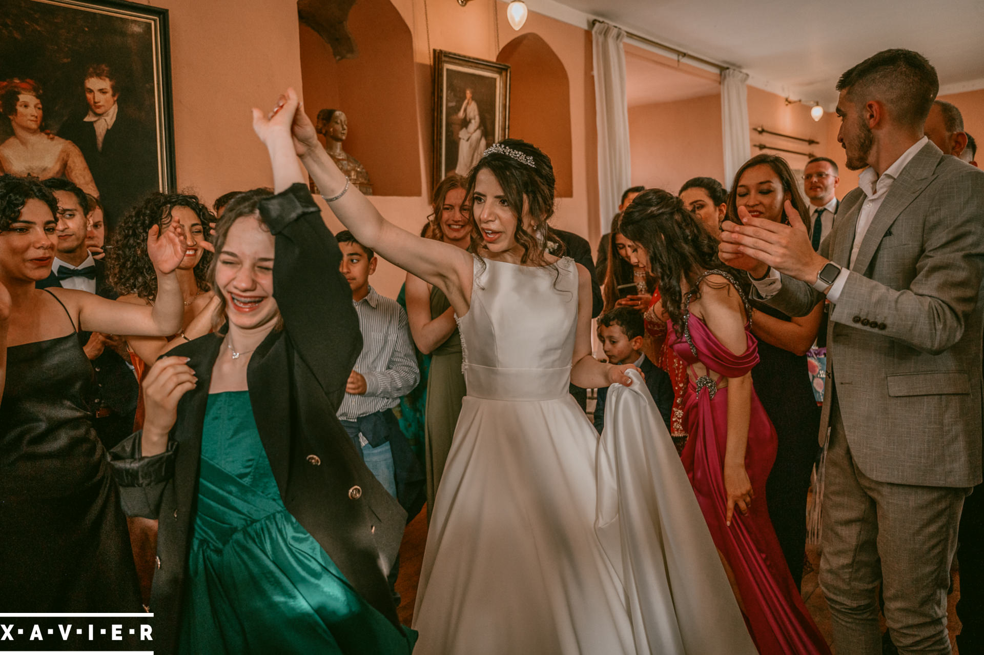 bride dances with a younger guest