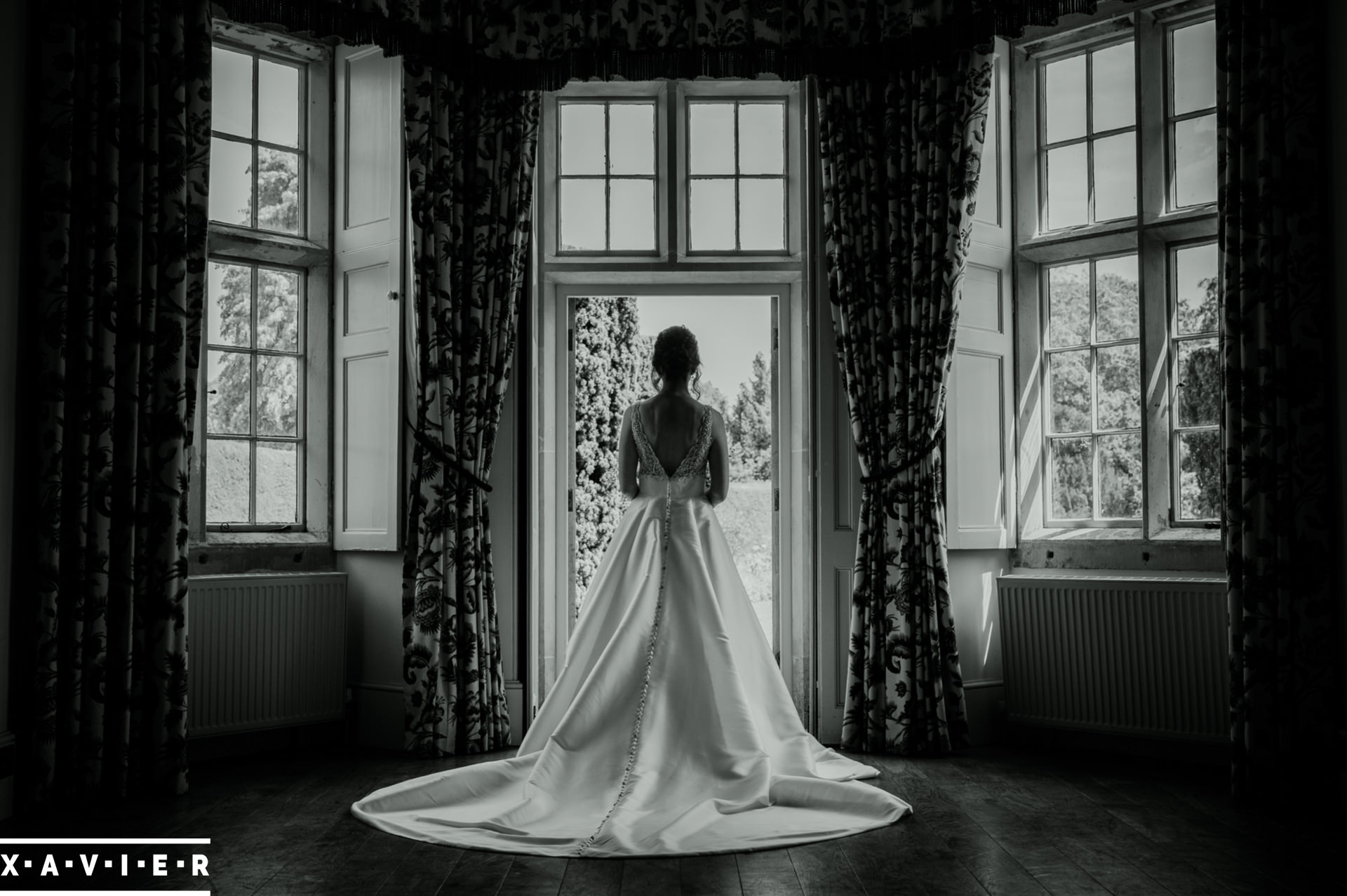 Bride stands with her back to the camera