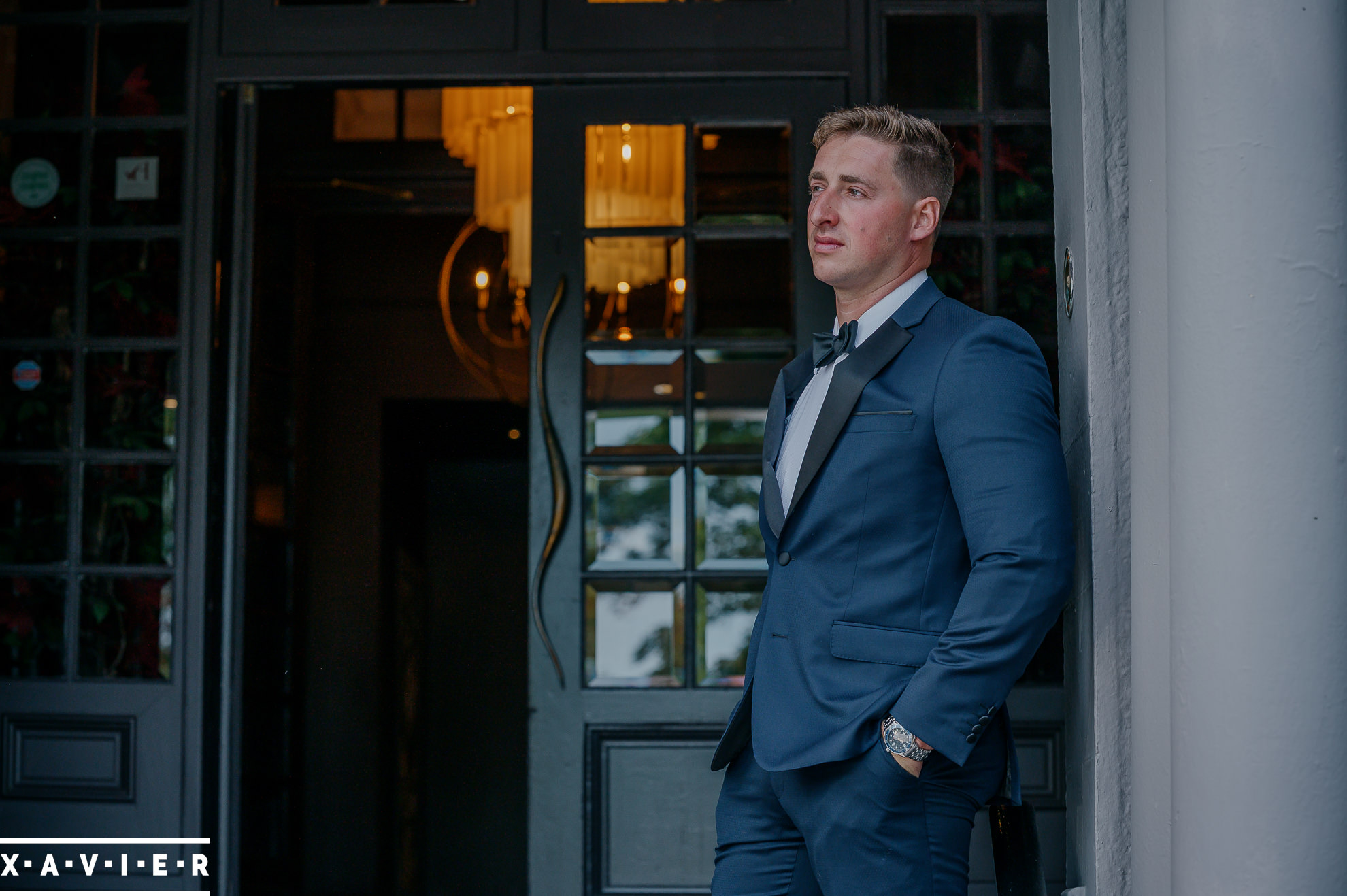 groom stands outside harrogate hotel