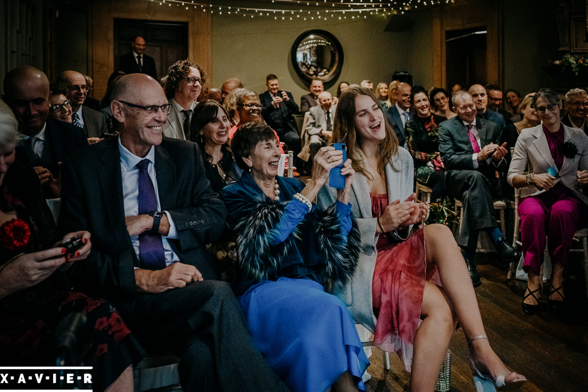 guests taking photos during the ceremony