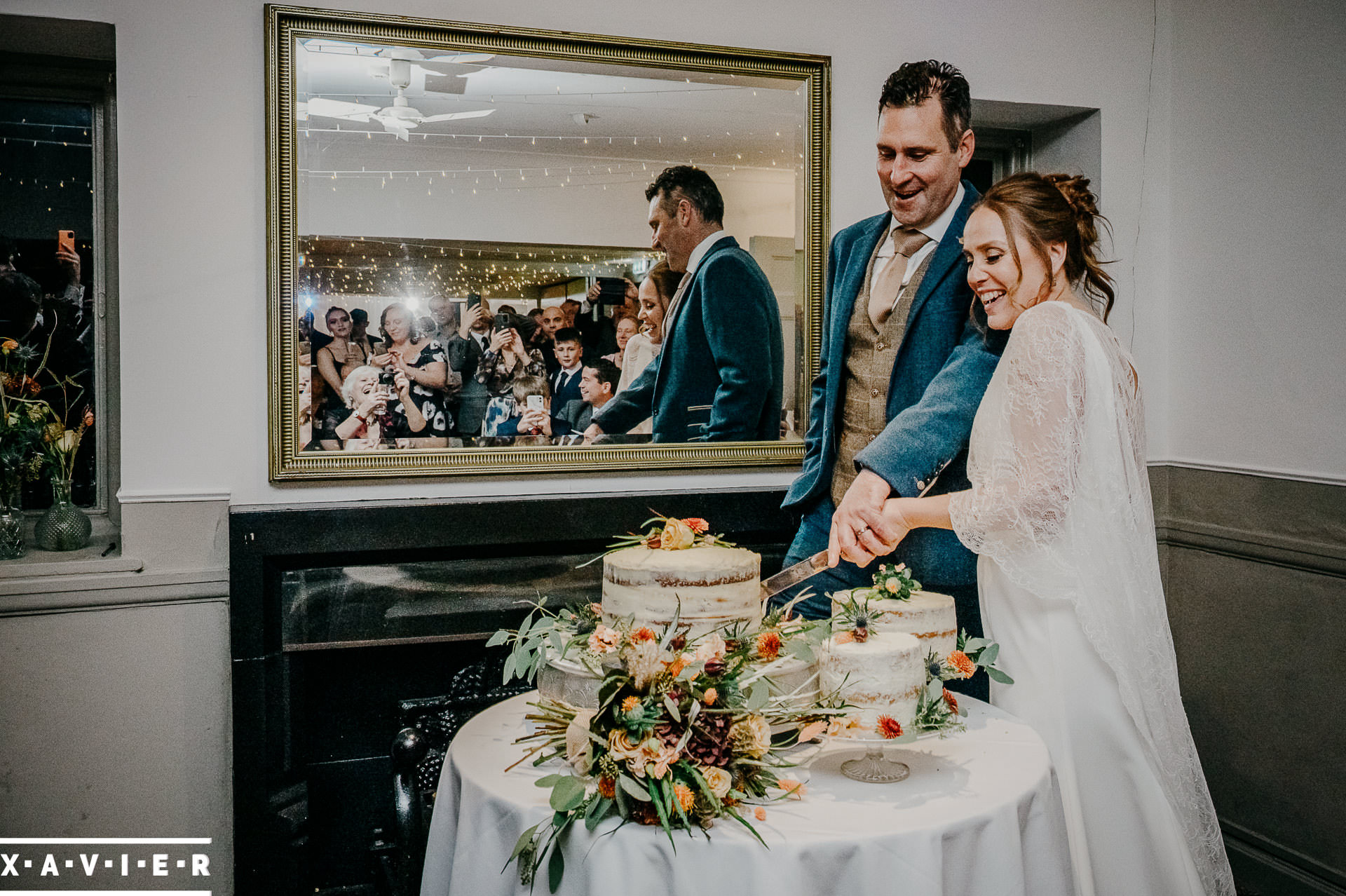 bride and groom cutting the wedding cake