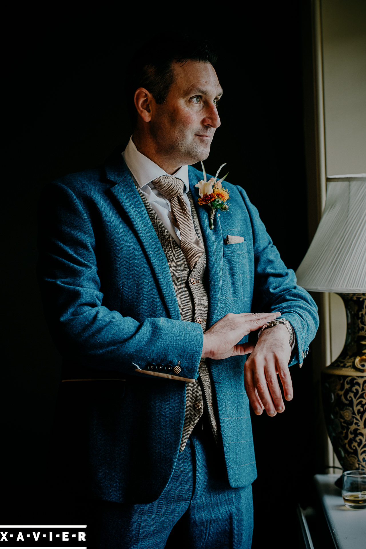 groom checks the time